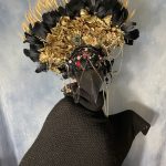 Stylized peacock with gold embellishments