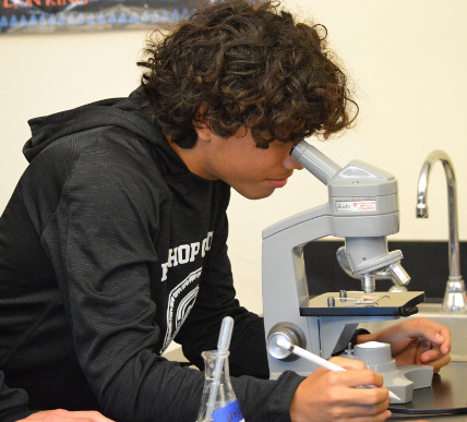 boy with microscope