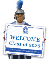 Trojan Mascot holding Class of 2026 sign