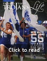 Trojan Tribune Logo directing you to click on the photo to view the magazine as a flipbook
